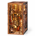 Minicity Abbey Library DIY Book Nook Kit featuring a warm illuminated multi-level medieval library with bookshelves, balconies and red spiral staircases