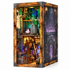 Minicity Blade and Magic DIY book nook kit featuring a fantasy dungeon with glowing blue portals, stone walls, wooden stairs and mystical details