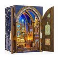 Minicity Notre-Dame Basilica DIY Book Nook Kit featuring an illuminated miniature Gothic Revival church interior with ornate arches, blue stained-glass details and golden statues