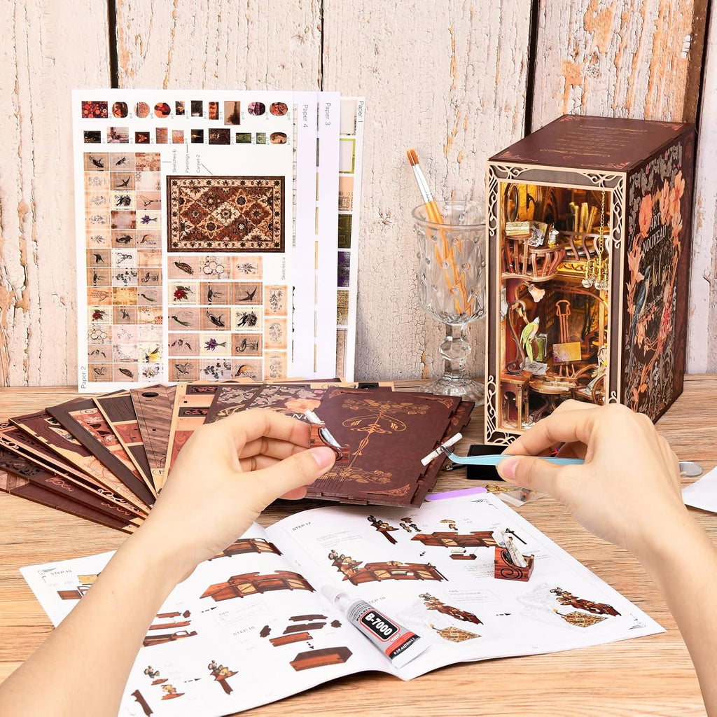 Building the Minicity Painter's Day at Dusk DIY book nook with wooden components, printed panels, miniature furniture and assembly instructions