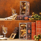 Minicity Painter's Day at Dusk book nook displayed as artistic home decor with books, paintbrushes and dried flowers