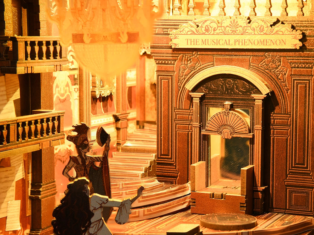 Minicity Phantom of the Opera book nook close-up featuring the ornate theatre arch, miniature opera characters, staircase and decorative stage entrance