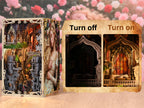 Minicity Sleeping Beauty book nook with soft LED lighting showing the illuminated stained glass window and sleeping princess scene