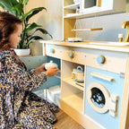 ROBUD Dream Wooden Play Kitchen being used by a child for imaginative cooking and pretend household play