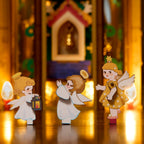 ROKR Angel's Christmas Pyramid close-up showing three miniature angel figures with wings, festive outfits and lantern details