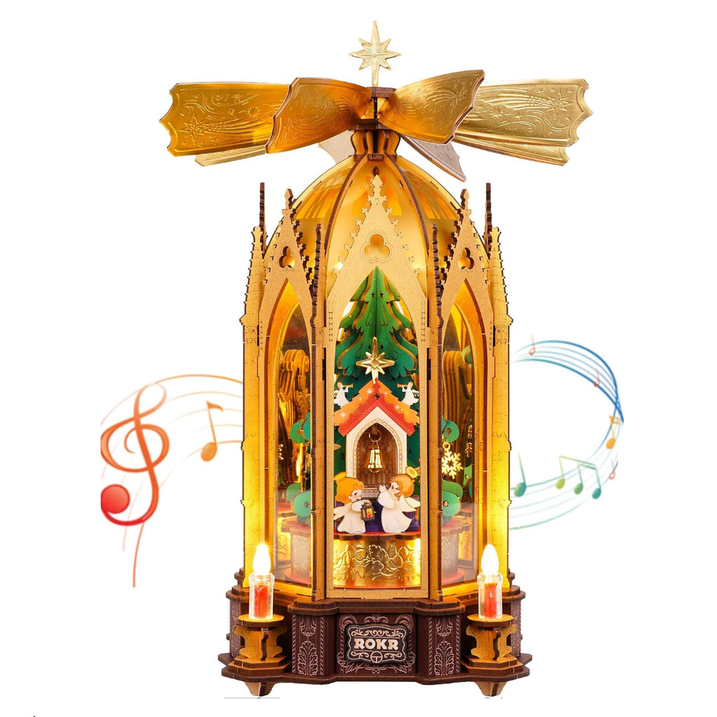 ROKR Angel's Christmas Pyramid DIY mechanical model kit featuring a rotating Christmas tree scene, wooden Gothic arches, golden fan blades and electronic candle lights