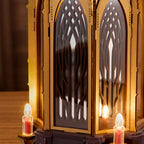 ROKR Angel's Christmas Pyramid close-up showing glowing electronic candle lights, decorative wooden supports and warm illumination