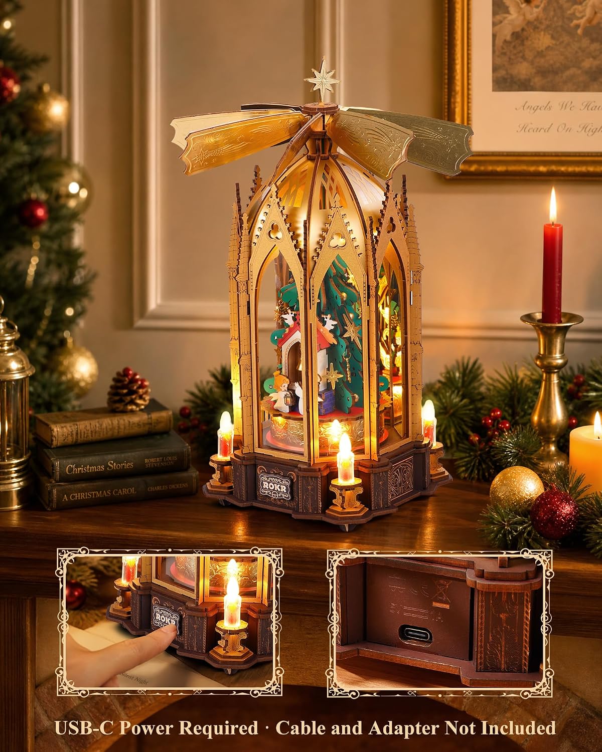 ROKR Angel's Christmas Pyramid displayed on a wooden table with Christmas books, ornaments, candlelight and warm festive decorations