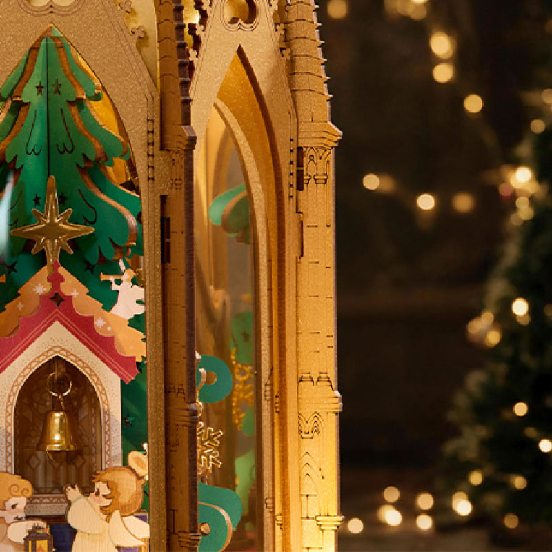 ROKR Angel's Christmas Pyramid close-up highlighting pointed Gothic arches, intricate latticework, decorative columns and the miniature Christmas scene