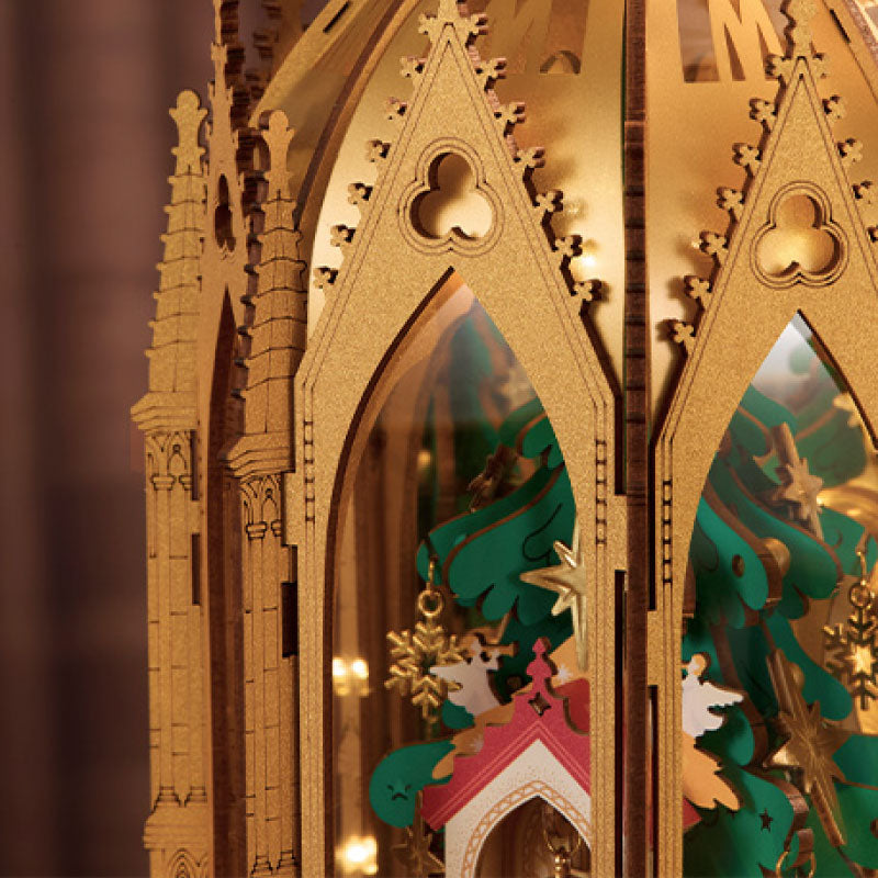 ROKR Angel's Christmas Pyramid featuring tall pointed Gothic arches and decorative cut-out windows that cast patterned shadows when illuminated