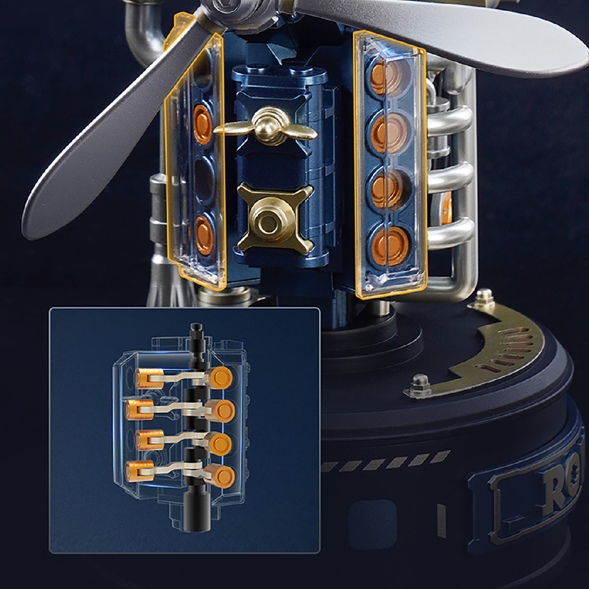 ROKR Beacon Tower mechanical model close-up featuring transparent panels, orange internal components, silver pipes and miniature industrial mechanisms