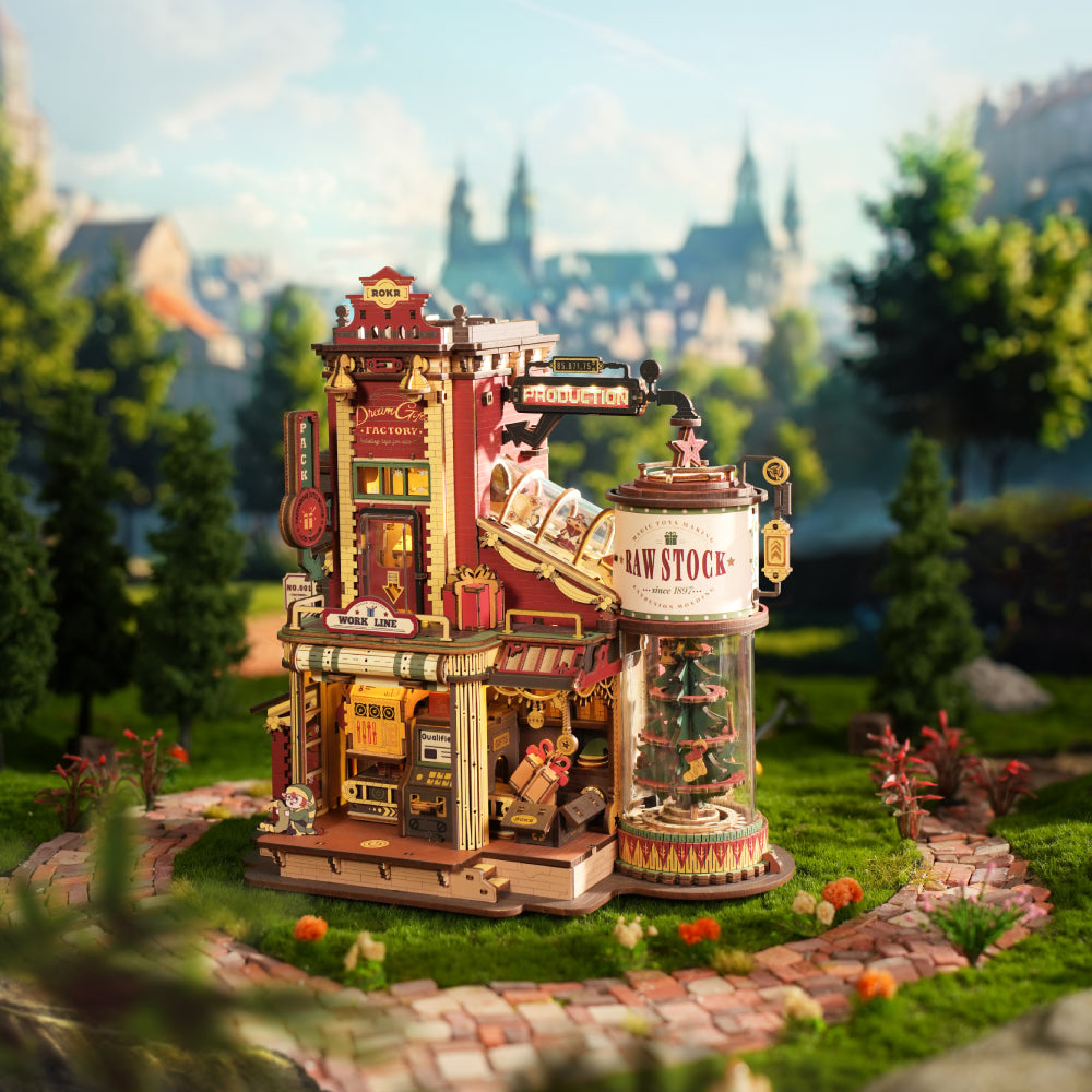ROKR Dream Gift Factory wooden mechanical model displayed in a colourful outdoor setting with detailed production machinery