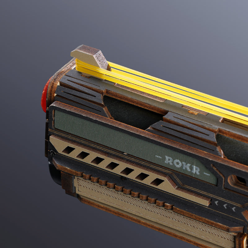 ROKR Legato C18 wooden model close-up highlighting the front section, yellow rubber bands and dark layered exterior panels
