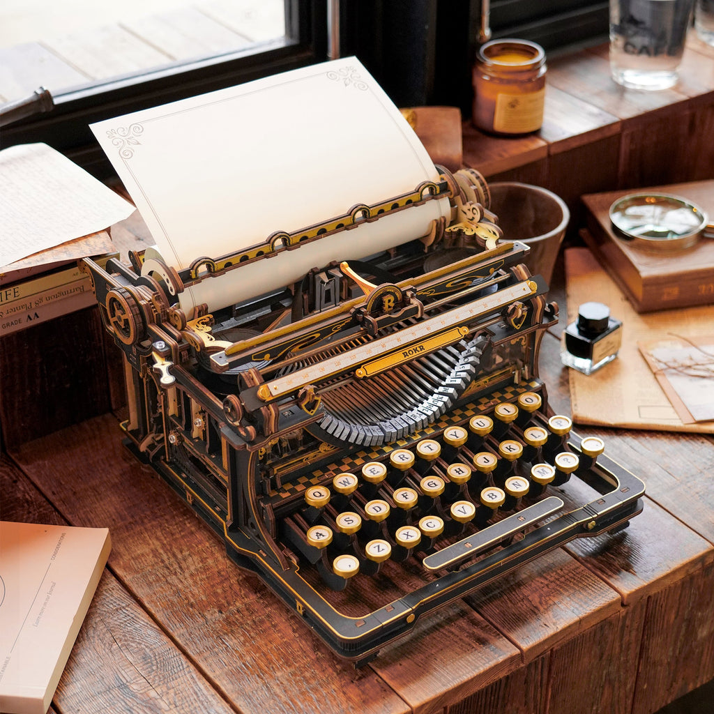ROKR Mechanical Typewriter wooden model displayed on a vintage desk with paper roller, keyboard and mechanical details