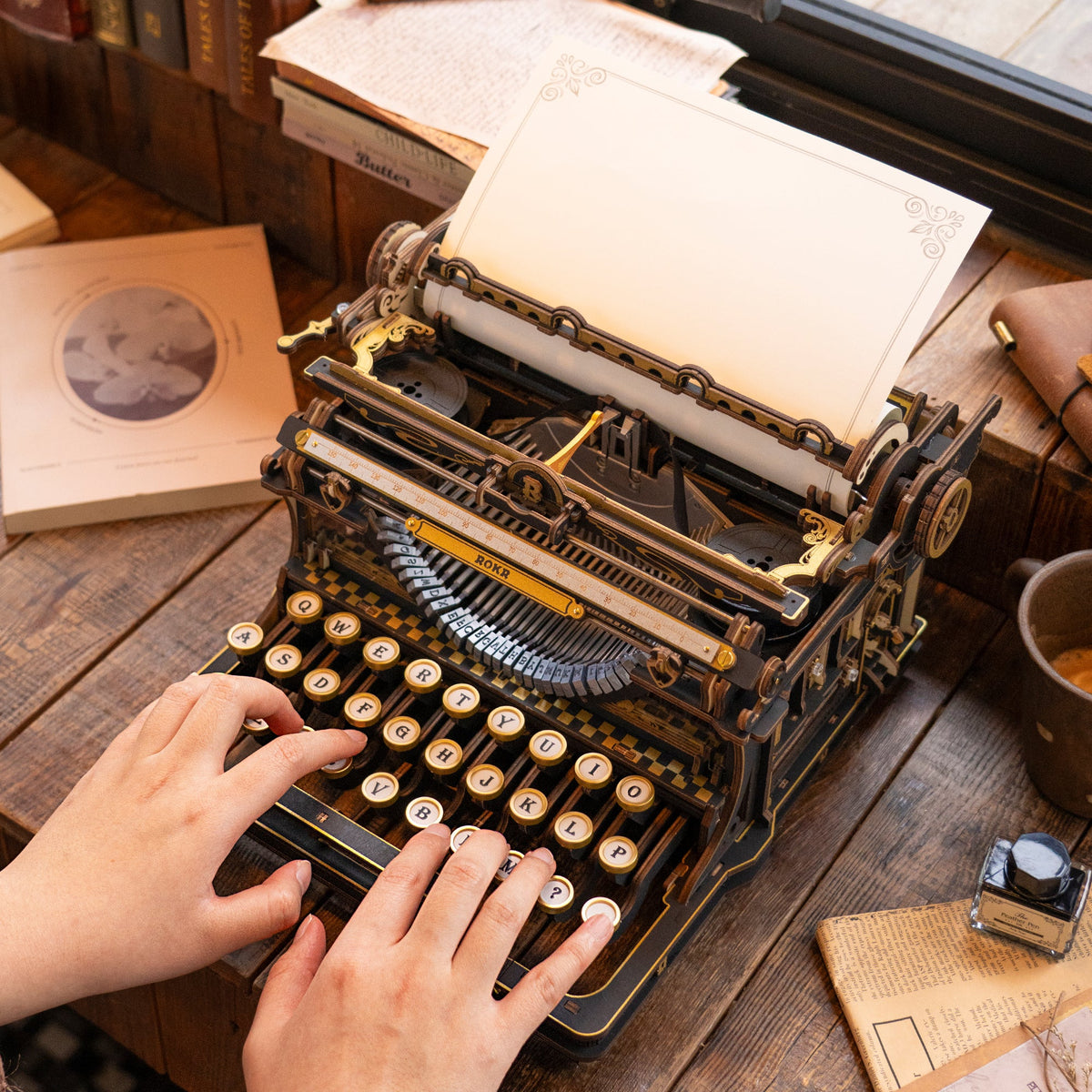 ROKR Mechanical Typewriter being used for typing with working keys, paper roller and functional mechanical carriage