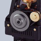 ROKR Thermo Engine belt-driven pulley system showing the metal-look drive wheel, connecting belt and detailed mechanical housing