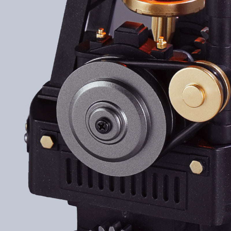 ROKR Thermo Engine belt-driven pulley system showing the metal-look drive wheel, connecting belt and detailed mechanical housing