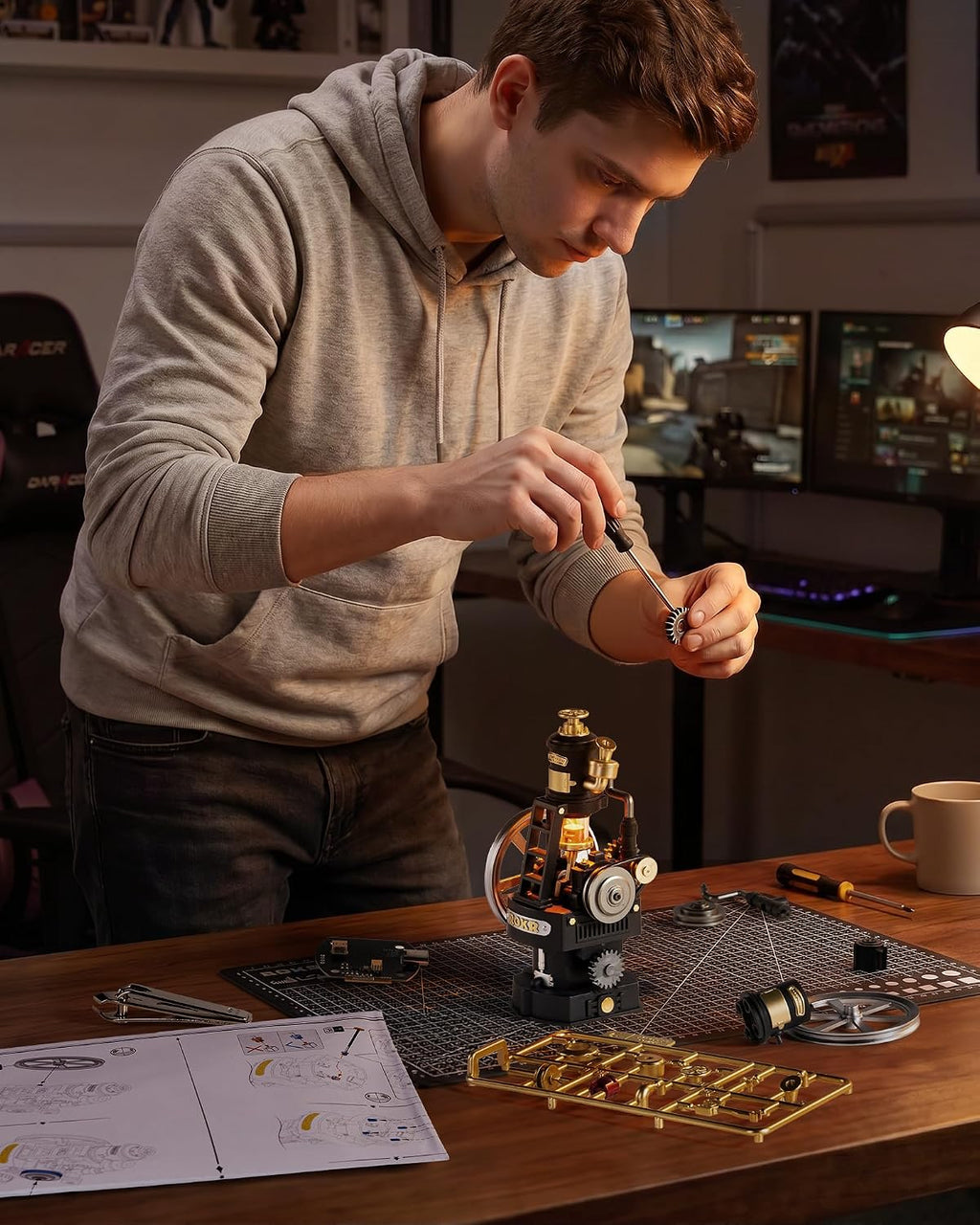 ROKR Thermo Engine DIY mechanical model being assembled by hand with small gears, engine components and illustrated instructions
