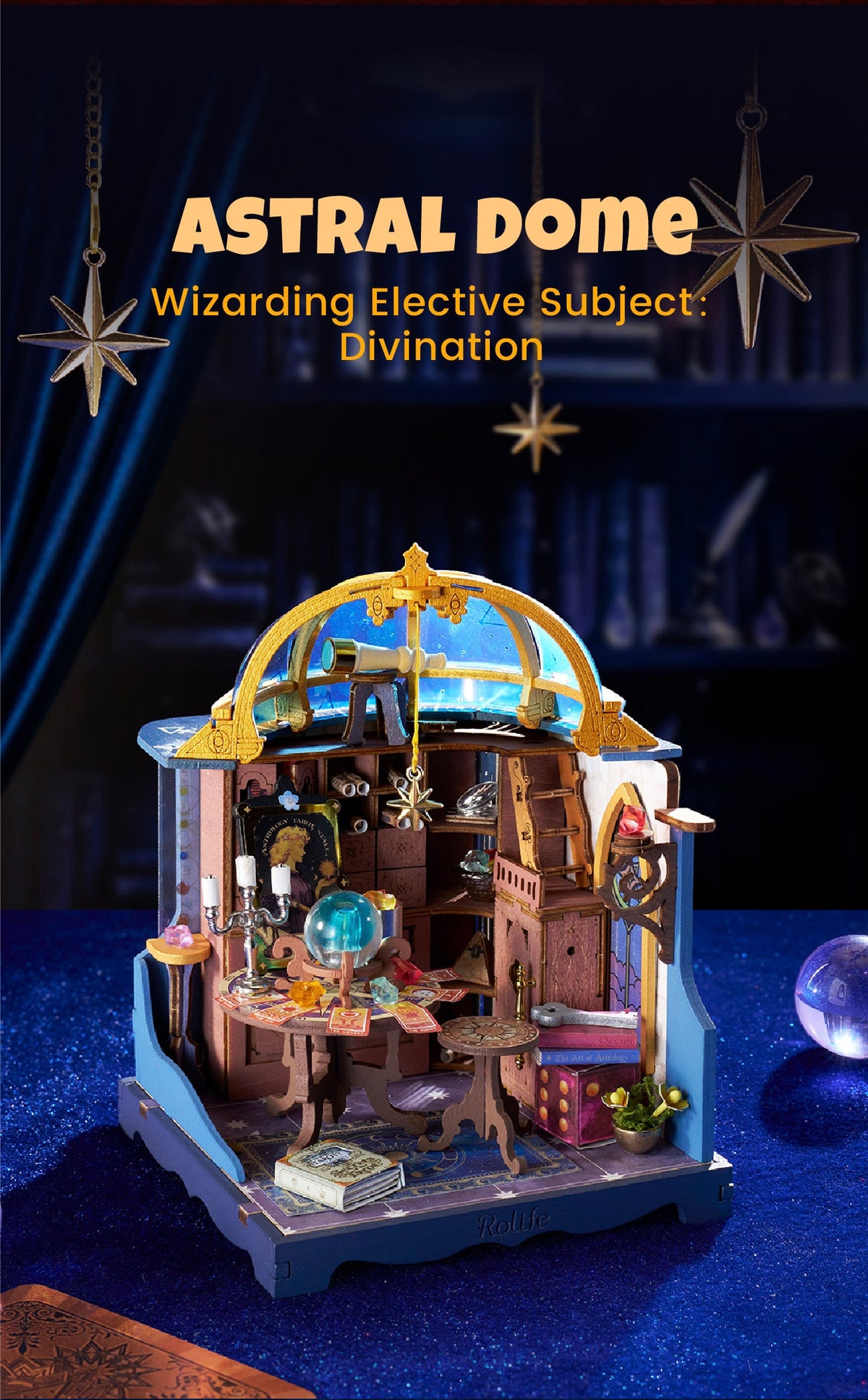 Rolife Astral Dome DIY miniature house displayed against a dark celestial backdrop with hanging gold stars, a blue dome, telescope and miniature tarot study