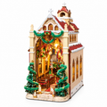 Rolife Caroling Cathedral DIY book nook kit featuring a miniature Christmas cathedral with snow-covered roofs, stained glass windows, festive garlands and warm LED lighting