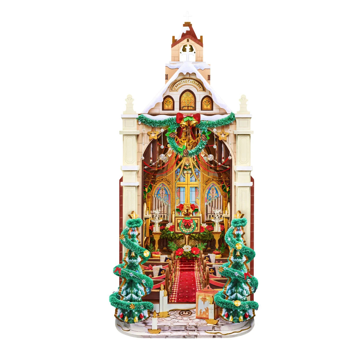 Rolife Caroling Cathedral miniature book nook featuring colourful stained glass windows, a central cross, ornate altar, red carpet and decorated Christmas trees