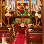 Rolife Caroling Cathedral interior close-up showing the decorated altar, miniature pews, stained glass windows and warm LED lighting effects