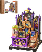 Rolife Curio Corner DS056 miniature house kit with the illustrated product box and completed purple cabinet featuring a wizard hat, potion bottles, crystal balls and magical books