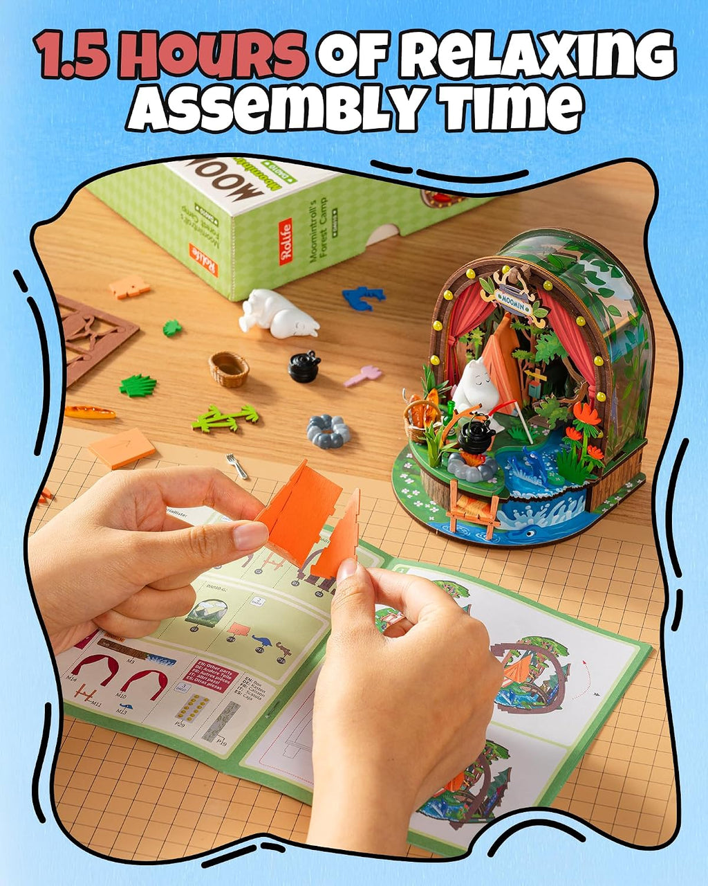 Rolife Moomintroll's Forest Camp DIY miniature kit being assembled by hand with illustrated instructions and individual camping scene components
