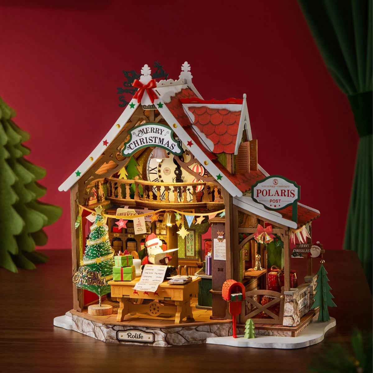 Completed Rolife Polaris Post miniature Christmas house with a glowing interior, red roof, Santa figure, Christmas tree and festive post office details