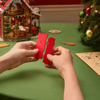 Rolife Polaris Post DIY miniature house assembly showing red wooden panels and precision-cut interlocking joints for glue-free construction