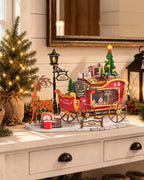 Rolife Reindeer Express miniature Christmas sleigh displayed on a white console table beside a decorated Christmas tree and festive lantern