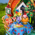 Rolife Snorkmaiden's Garden Party close-up showing miniature cakes, drinks, fruit, flowers and a blue floral tablecloth