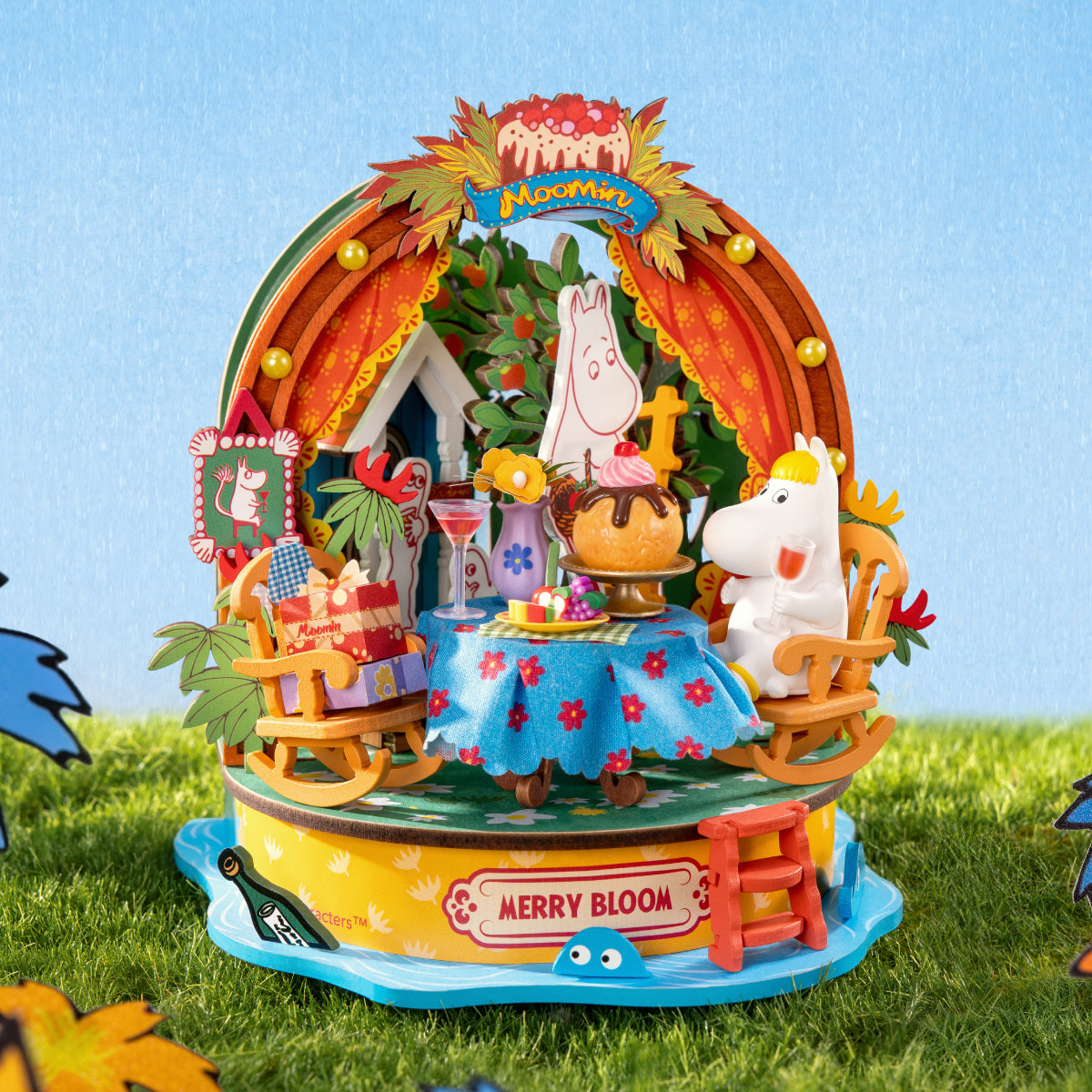 Rolife Snorkmaiden's Garden Party miniature display with Moomin characters, orange garden arch, rocking chairs, flowers and a festive table