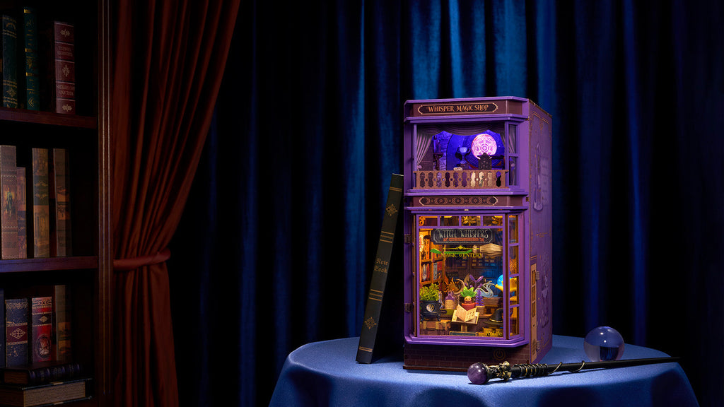 Rolife Whisper Magic Shop DIY book nook with four ambient lights creating a glowing purple and warm fantasy display